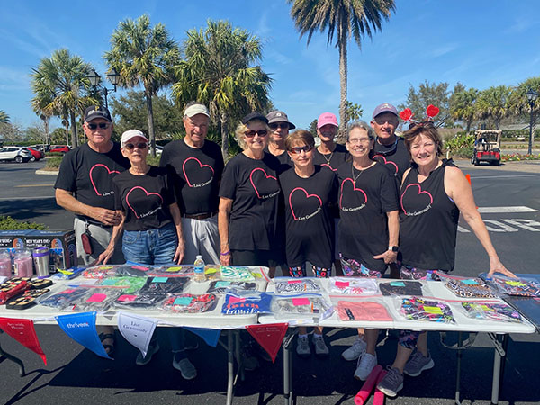 Group of volunteers standing at the registration table