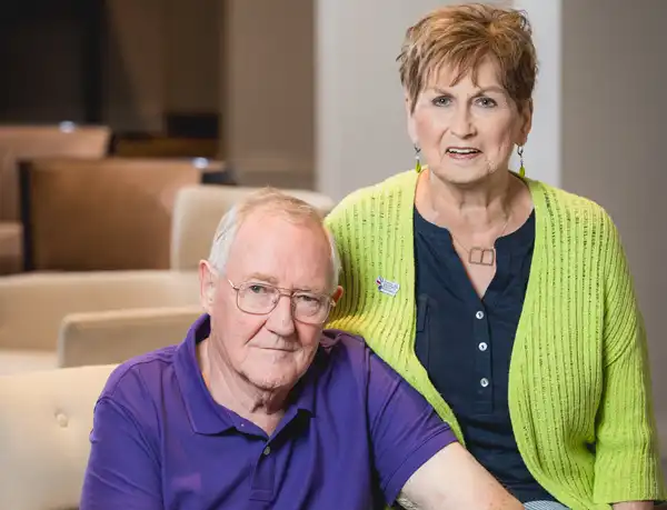 Jim and Barbara sitting and smiling