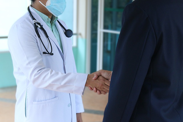 Doctor and patient shaking hands