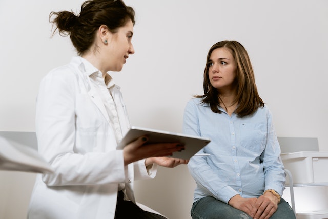 Doctor speaking with patient in office