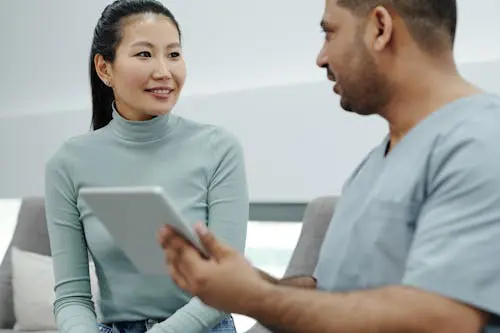 Woman speaking with doctor