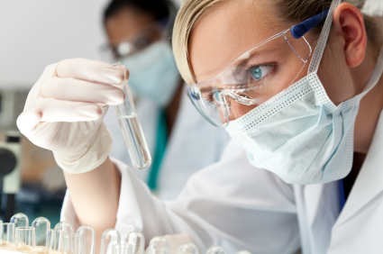 Medical researcher looking at test tube