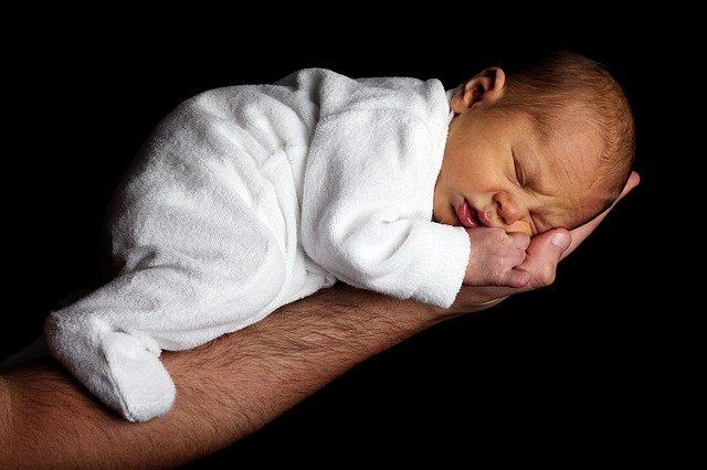 Father holding infant