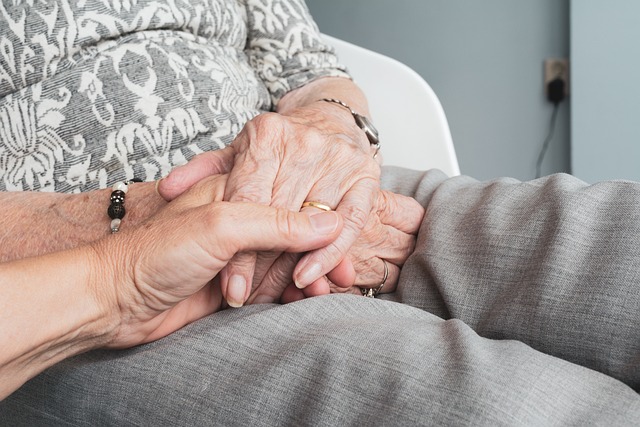 Older people holding hands